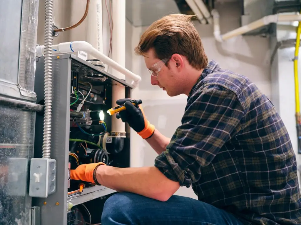 Home Repairman Working on a Furnace